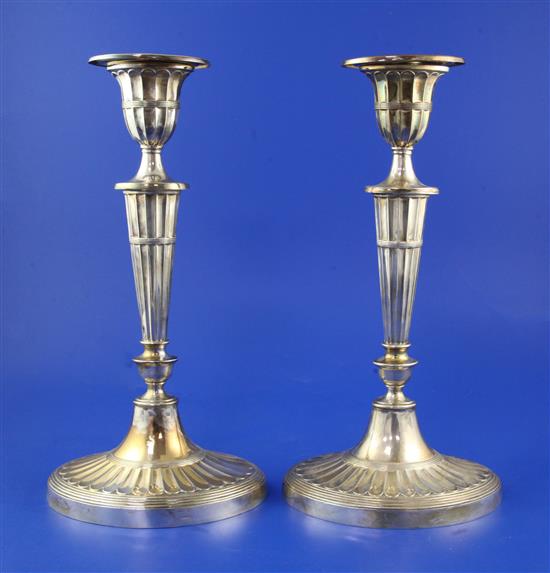 A pair of early 1960s silver candlesticks, weighted.